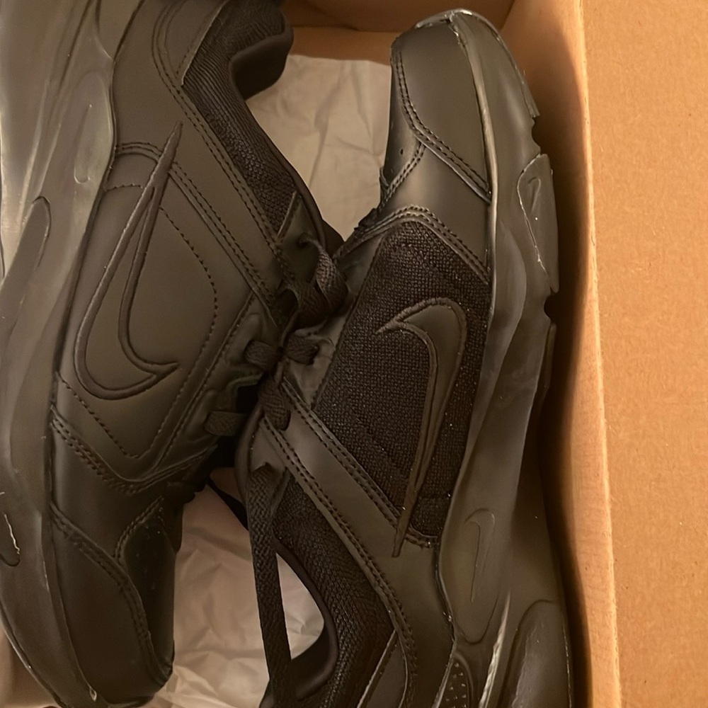 Nike all black leather and mesh tennis shoes in men’s size 7.